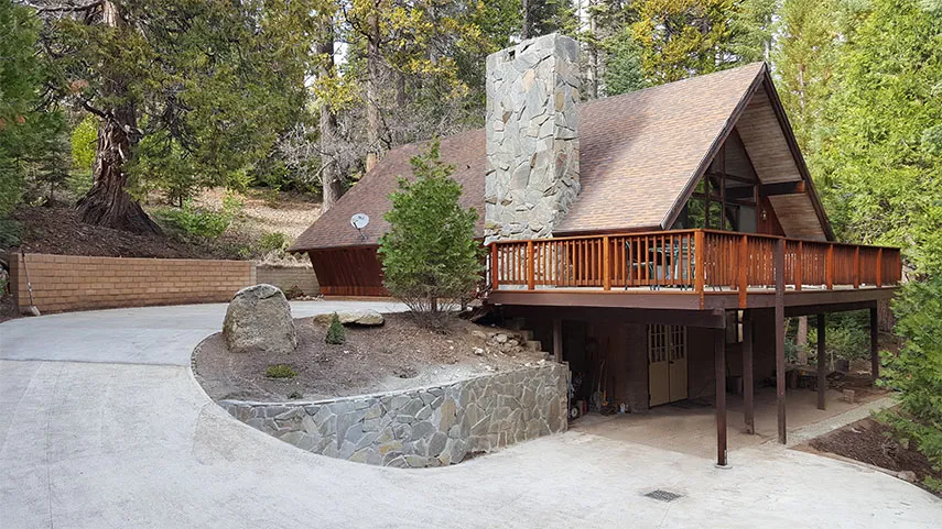 The driveway, with parking for 3 cars and the lower patio