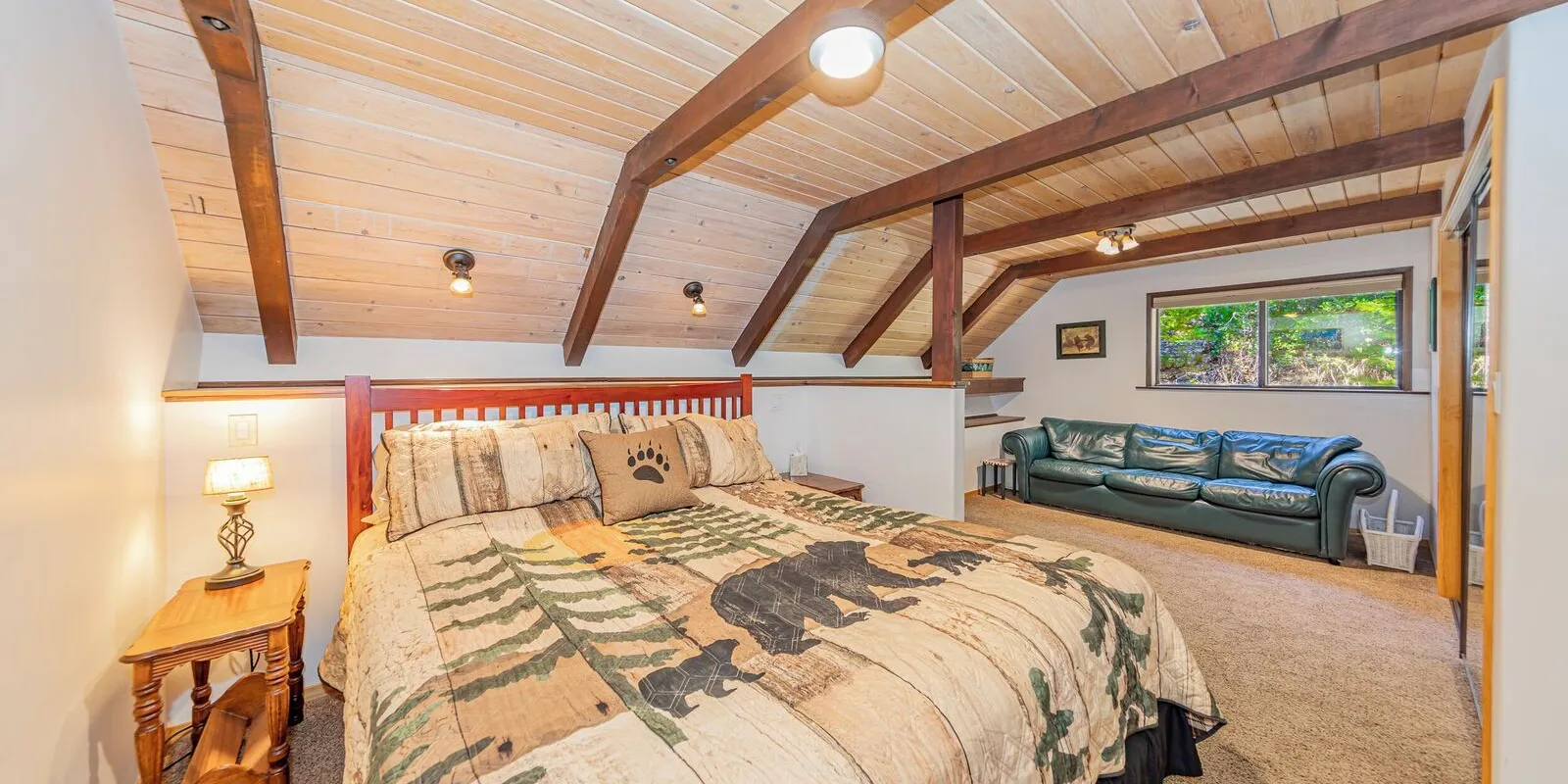 The master bedroom: a California King bed, a couch and a skylight